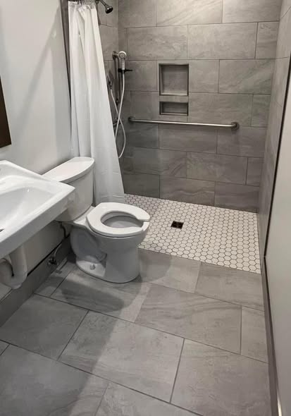 Finished AVS Flooring project with gray tile bathroom